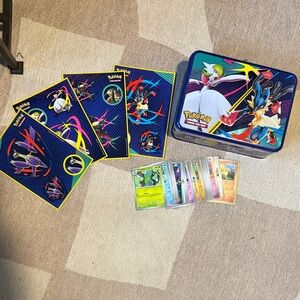 Pokémon Trading Card Game Tin with Stickers and Random Large Lot of Cards